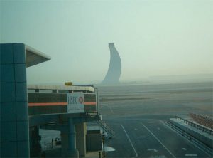 A foggy image of the Abu Dhabi airport tower